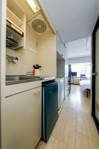 a kitchen with a sink and a counter at Piazza-U Yutenji by Tranova in Tokyo