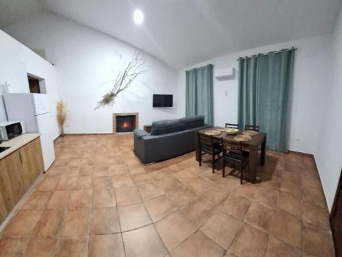a living room with a couch and a table at Casas rurales La Colada in El Viso