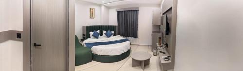 a room with a bedroom with a bed in it at Hotel Signature Bopal in Ahmedabad