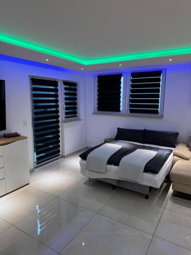 a bedroom with a bed and a green ceiling at Premium Apartment near Cologne in Hürth