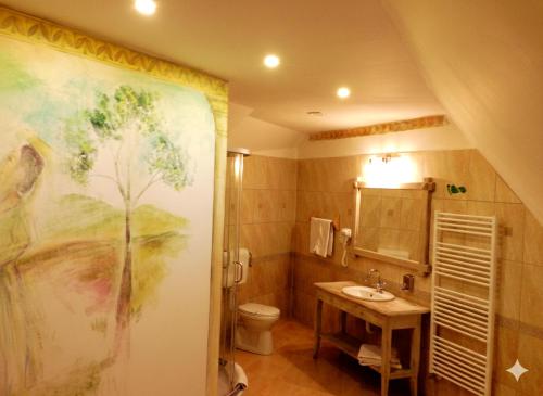 a bathroom with a sink and a toilet at Boutique Hotel ,,Villa Franca'' in Sighişoara