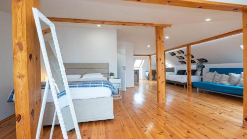 a bedroom with a bunk bed and a ladder at Villa Alenor – Sea View & Beach Access in Nesebar