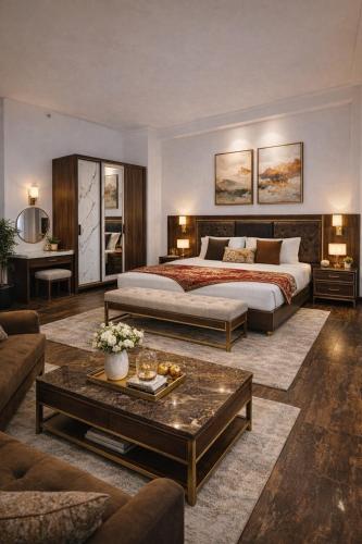 a large bedroom with a bed and a coffee table at Himalayan Canvas khajjiar in Khajjiar 