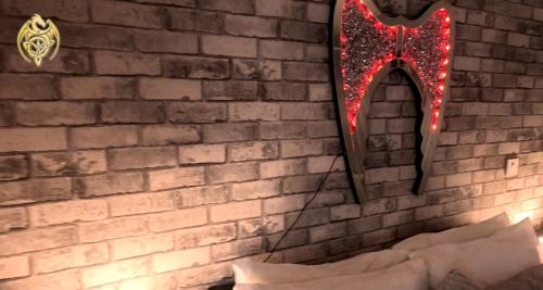 a mirror hanging on a brick wall with christmas lights at The Celtic Pride Hotel in Blackpool