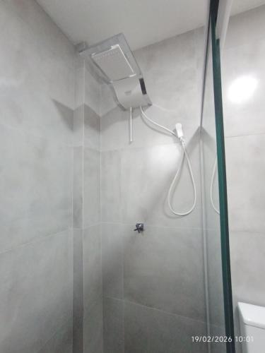 a bathroom with a shower with a shower head at Casa Lego Paraty in Paraty
