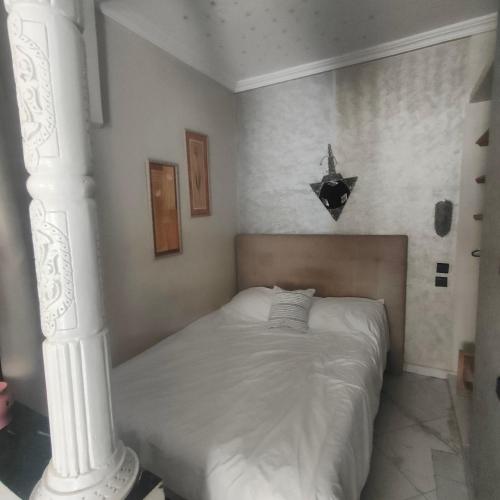 Un pat sau paturi într-o cameră la Studio Relax