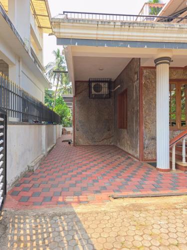 an empty courtyard of a building with a basketball hoop at Spacious 2 Bedroom Private House in Mangalore Fully Air-Conditioned, WiFi & Parking in Mangalore