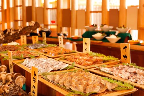 a buffet with many different types of food on display at Hotel Tokinoza in Kihokucho
