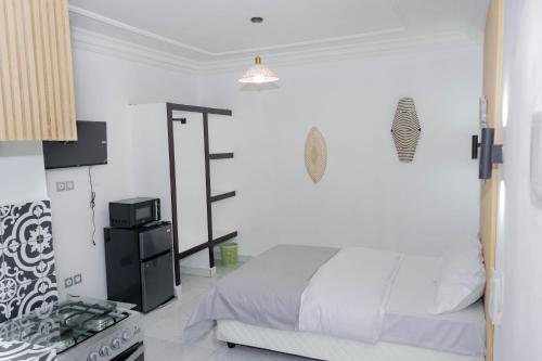Llit o llits en una habitació de Bonam Residence