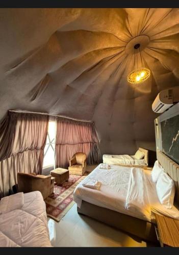 En eller flere senge i et værelse på Wadi rum Nader