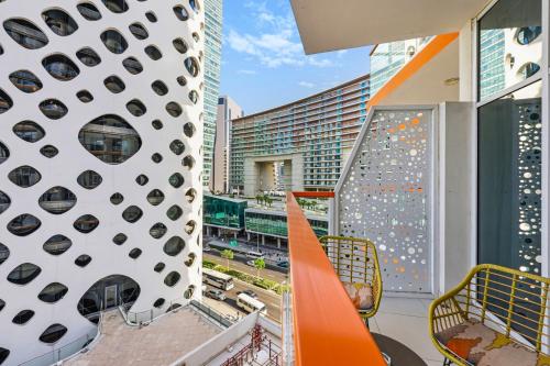 an apartment balcony with a view of a city at Stylish Escape with Balcony, Canal and Burj Khalifa Views Near Dubai Mall in Dubai