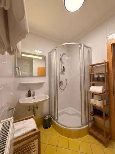a bathroom with a shower and a sink at Hof Oberhaus in Kitzbühel
