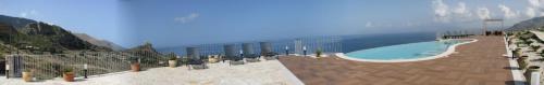 a rendering of a swimming pool on top of a mountain at Hotel Antica Cascina Del Golfo in Scopello
