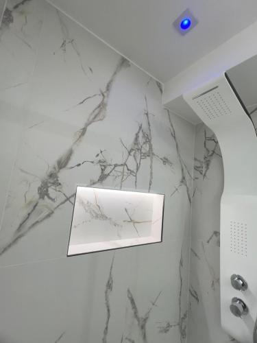 a white marble counter top with a card on it at Buonaventura house2 in Triggiano