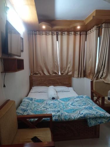a small bed in a room with a window at Hotel Sikder-02 Residential in Dhaka