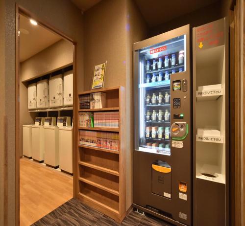 a vending machine in a store with drinks in it at Dormy Inn Abashiri in Abashiri