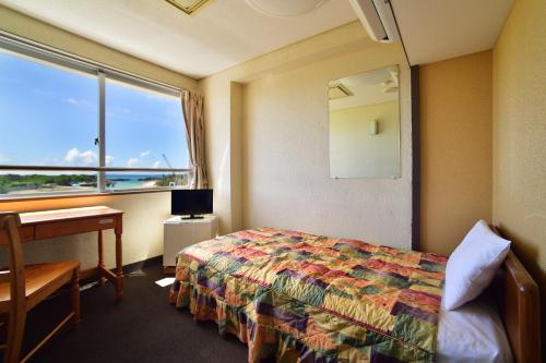 Ένα ή περισσότερα κρεβάτια σε δωμάτιο στο Hotel South Island