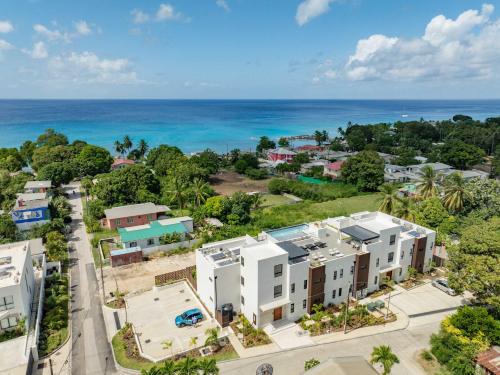 an aerial view of a city with the ocean at Elegant LUX 2BR 3mins to Beach Pool & Deck in Saint James