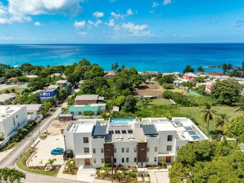 an aerial view of a resort with the ocean in the background at Elegant LUX 2BR 3mins to Beach Pool & Deck in Saint James