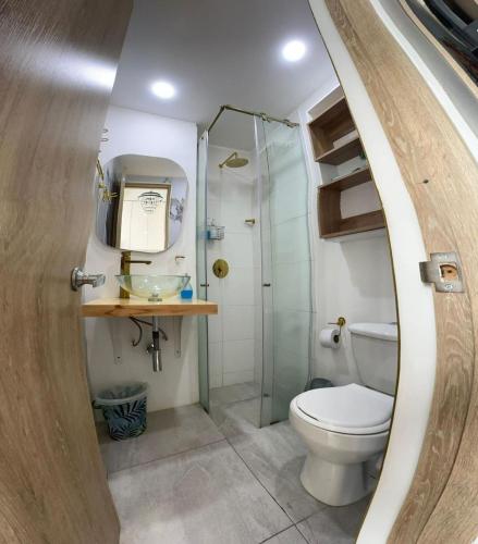 a bathroom with a toilet and a shower at Exclusive Tiny Loft in Usaquén in Bogotá
