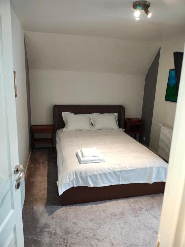 a bedroom with a bed with a book on it at Panaghie in Hangul