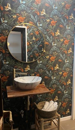 a bathroom with a sink and a mirror at AIRE Vejer - recién reformado 2026 in Vejer de la Frontera