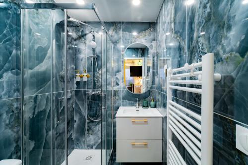 a bathroom with a shower and a sink at Paris - Blue Sky Homestay in Le Kremlin-Bicêtre
