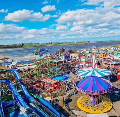 an aerial view of a carnival on the beach at The Bunkhouse in South Shields