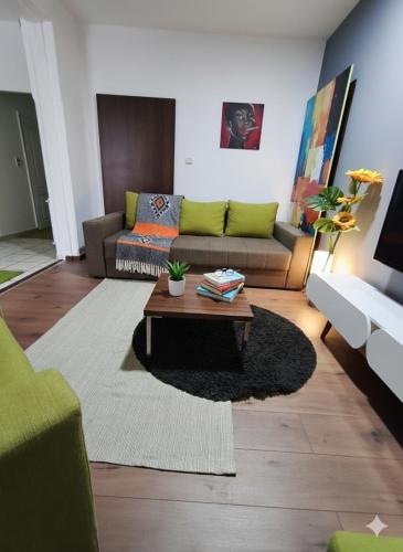 a living room with a couch and a coffee table at Fast Sleep & Go 1 in Paraćin