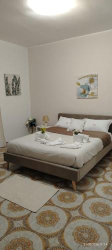 a bedroom with a large bed in a room at Casa Monteserrato in Terrasini