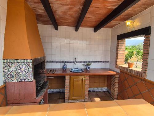 a kitchen with a counter and a stove in a room at Villa Florida in Motril