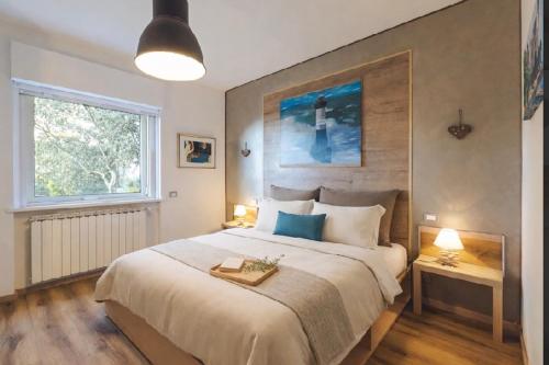 a bedroom with a large bed and a window at Trieste Sea Life in Trieste