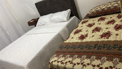 a bed in a room with at Casa Samambaia in Piranhas