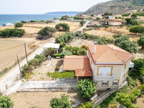 an aerial view of a house with a yard at Ocean Melody in Megás Limniónas