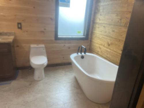 Luxe Cabin with Game Room, Hot Tub & Firepit photo 11