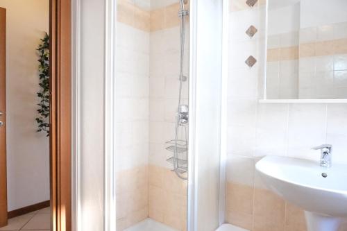a bathroom with a shower and a sink at Casa Segantini - Relax Apartment 2 in Arco