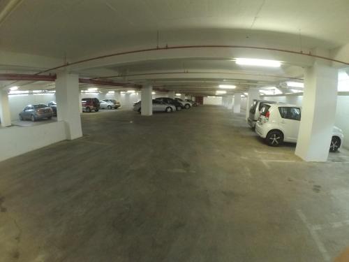 an underground parking garage with cars parked in it at Studio Exclusive (Kota Bharu City Point) in Kota Bharu
