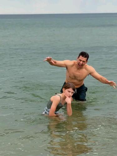 a man and a woman standing in the water at Blue Moon Villa in Waskaduwa
