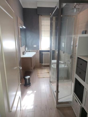 a bathroom with a shower and a sink and a toilet at Flat26 in Castiglion Fiorentino