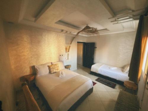 a bedroom with two beds in a room at hyle Surfhouse in Agadir
