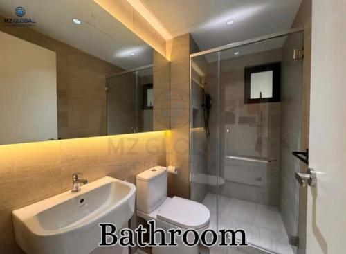 a bathroom with a toilet and a sink and a shower at Skyline Luxury Suite KlCC &TRX View in Kuala Lumpur