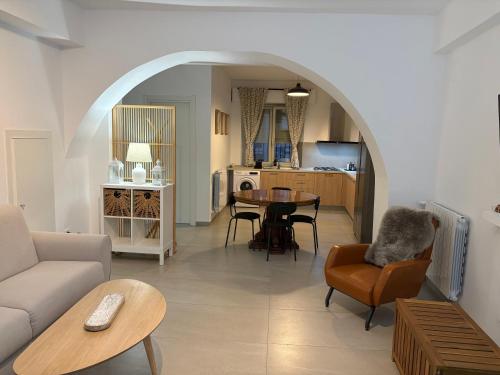 a living room with a couch and a table at HOMES By PALUMBO in Prunella