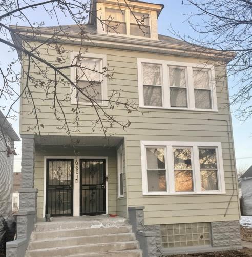 aige house with stairs in front of it at City Retreat in Chicago