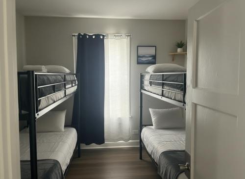 a room with two bunk beds and a window at City Retreat in Chicago