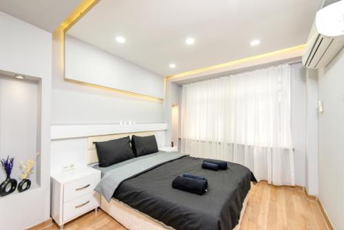 a bedroom with a large bed and a window at İstanbul Amoria Guest House in Istanbul