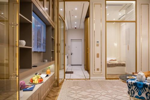 a hallway with a table and a room at NOVA HOME Apartments - NEST ONE, Panoramic Views, Tashkent City in Tashkent
