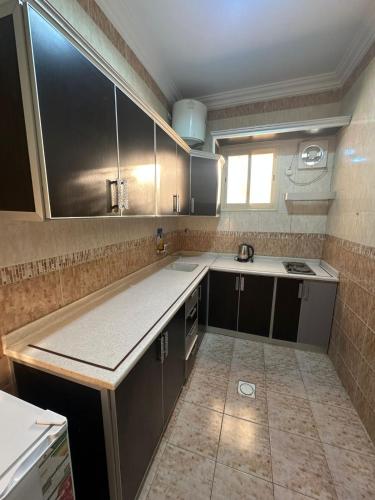 a kitchen with a sink and a counter top at جميــرا لاين in Abha