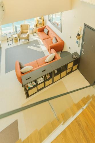 an overhead view of a living room with orange furniture at Villa Dream in Kuşadası