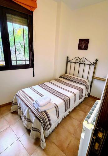 a bedroom with a bed in a room at Casa Angel 3 in Castril
