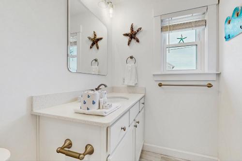 a white bathroom with a sink and a mirror at AV723 Prickly Pear 723 in Avon